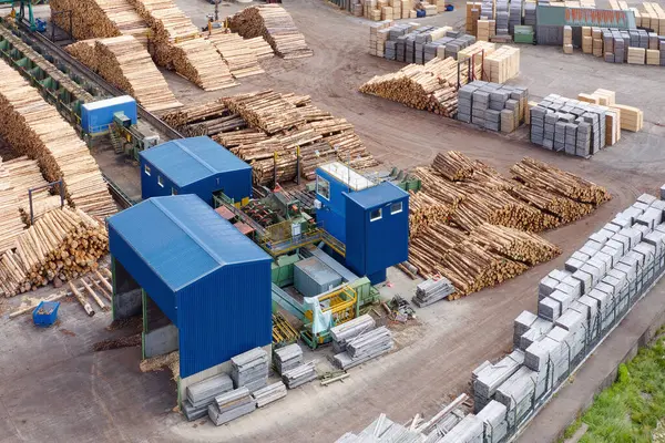 stock image Sawmill with chopped wood logs stacked and machinery UK