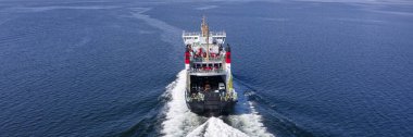 Ferry ship leaving Wemyss Bay and sailing to Rothesay clipart