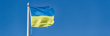 Ukraine flag fluttering in the wind suspended high the in sky UK clipart