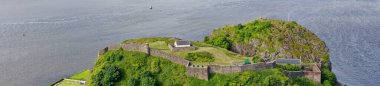 Dumbarton castle building on volcanic rock aerial view from above Scotland UK clipart