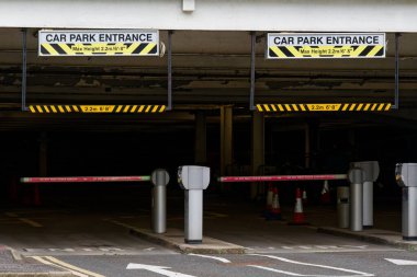 Car park entrance sign at multi-storey facility building UK clipart