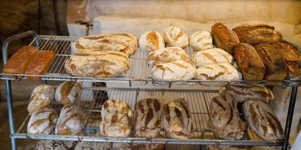 breads french loaves on shelves in shop Baked goods whole grain artisan bread