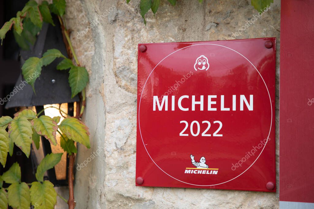 Bordeaux , Aquitaine  France - 11 01 2022 : Michelin 2022 red enamelled plaque book Guide plate text sign with logo brand on good Restaurant Wall building