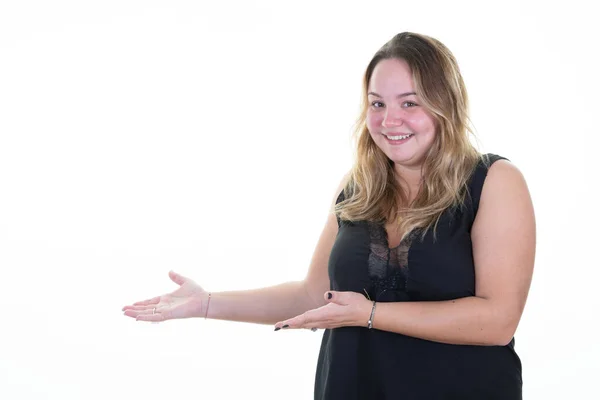 Stock image happy plump woman pointing finger and open palm hands demonstrating something object