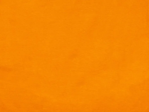 アンバーオレンジ色の質感コットンアートの背景生地繊維表面 — ストック写真