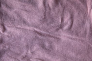 Pembe pamuk kumaş kumaş desenli pamuk menekşe forma arka planda katlar
