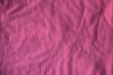 Pembe kumaş kumaş arka planda mor katlanmış kopya alanı