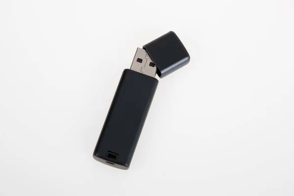 stock image flash drive open black usb key with cap computer device technology on white background