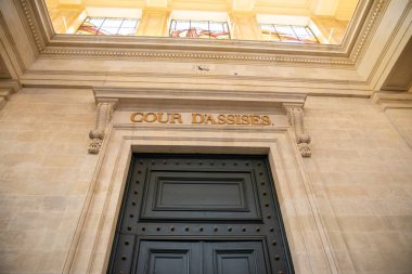 cour d'assises sign text on ancient wall interior building means in french assize court justice clipart