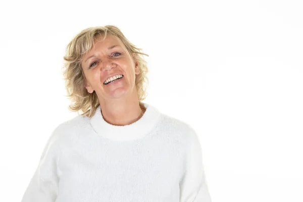 stock image 60 years blonde senior woman laughing mature with blue eyes blond on white background