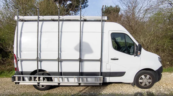 panel van white with ladder on side Transports Glass for crafts man