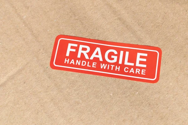 stock image Fragile handle with care sticker on brown carton package