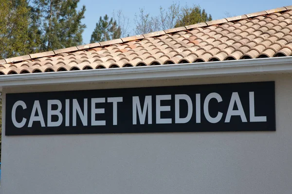 cabinet medical french text on facade means doctor office wall building sign