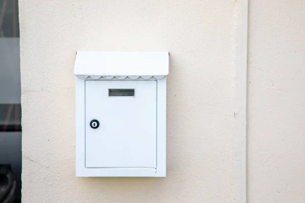 post mail letter box white mailbox on wall home facade entrance