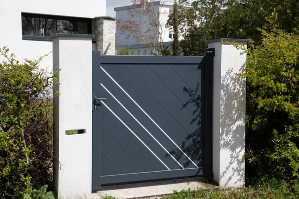 pedestrian entrance individual access door to standards for people with reduced mobility disabled and wheelchair of the house modern grey single home