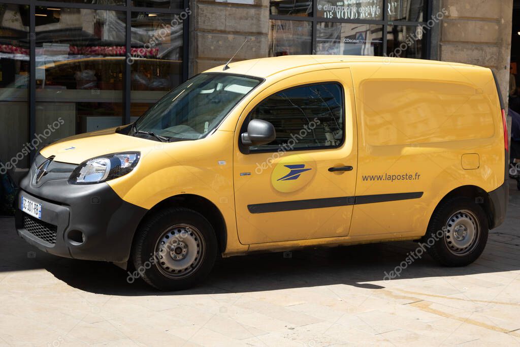 Bordeaux ,  Aquitaine France - 04 17 2023 : La Poste postman panel car Renault Kangoo van in French city with logo sign and brand text side of France post office