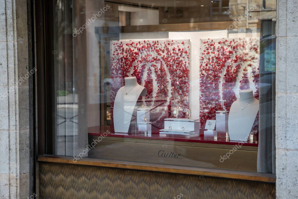 Lyon , Aura France - 05 01 2023 : Cartier logo sign and brand text front windows facade boutique fine jewelry watches