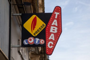 Bordeaux, Aquitaine France - 05 09 2023: tabac presse and fdj loto France national lotgo shop logo brand tobacco sign text press and lotto facade store French