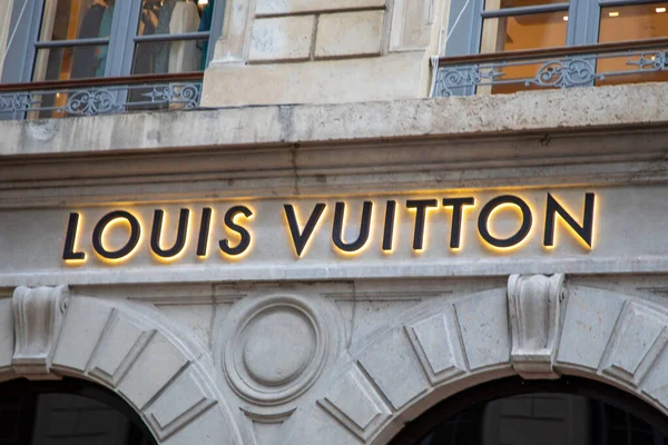 louis vuitton logo brand wall facade and sign text front entrance