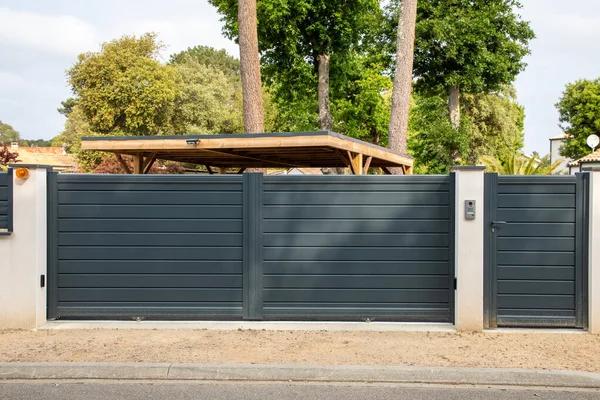 portal modern steel aluminum grey gate and pedestrian electric door suburb house