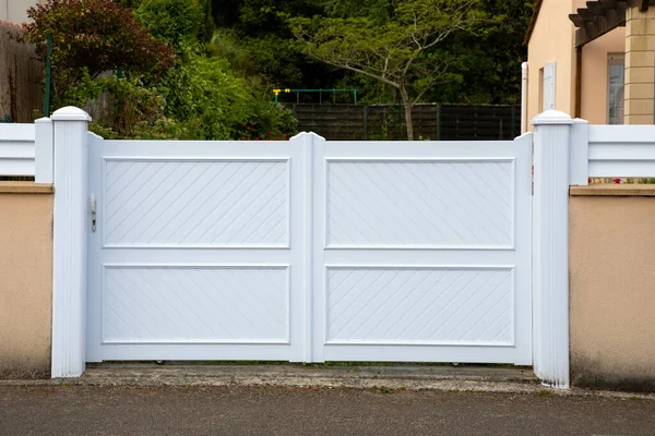 stock image high door facade modern white pvc plastic home gate portal of suburbs house street city