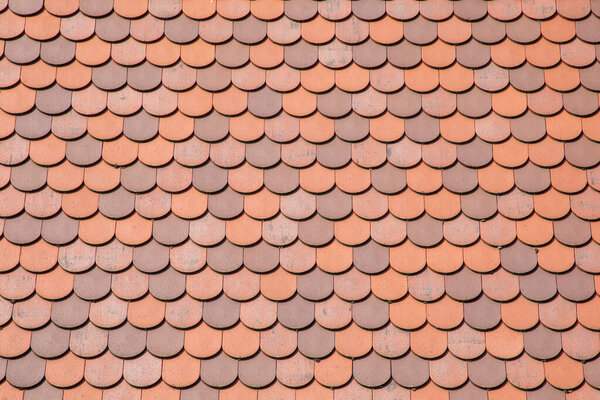 Red tile roof clay tiles roof of a private house made of shingles