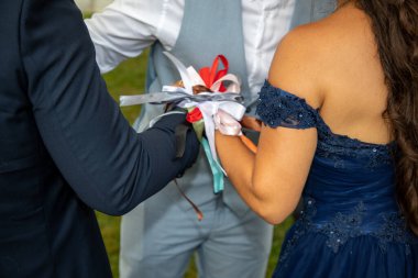 weeding hands newlyweds tied with ribbon in ancient Celtic ritual  marriage for bride and groom symbolize the binding of two live clipart
