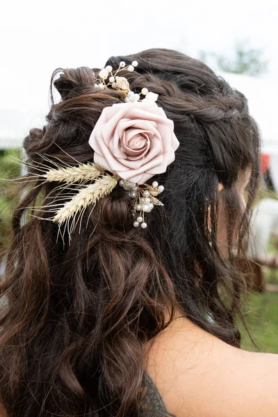 romantic wedding hairstyle bride hairs ornament coiffure rose and ears of wheat in brown hair outdoor back view