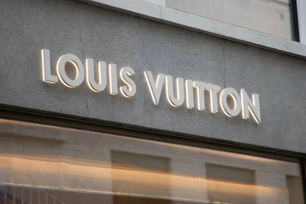 louis vuitton logo and sign text facade entrance store fashion brand  clothes shop in street view Stock Photo