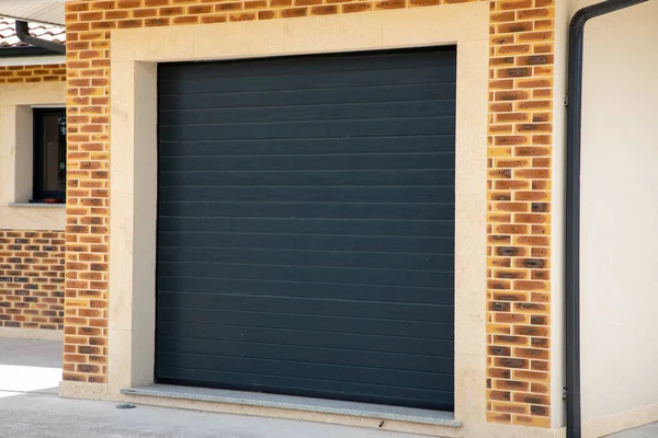 stock image automatic metal roller door large dark grey garage house gray and industrial warehouse
