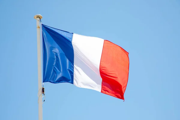 French tricolors blue white red flag patriot france fabric on mat blue sky waving