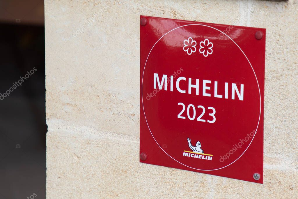 Saint-emilion , France -  08 19 2023 : Michelin 2023 restaurant logo sign and text brand of guides books published for good place label with good food