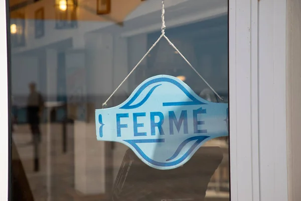 shop door panel store sign ferme french text means boutique closed board