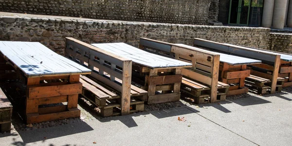 recycled wooden table and sit bench made from old wooden recycle storage pallet diy on bar restaurant terrace