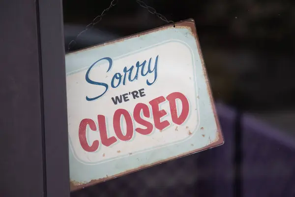 Sorry we are closed sign board steel panel hanging on boutique door of shop cafe