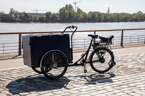 bike with a large tank in front for cargo delivery bicycle three wheeler