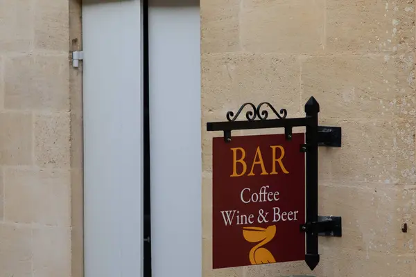 coffee wine and beer bar sign in city street
