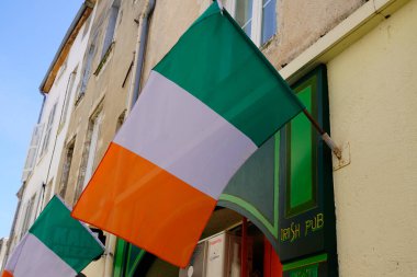 Bordeaux , France - 12 12 2023 : Bar facade irish orange white green flag of Ireland in wall entrance clipart