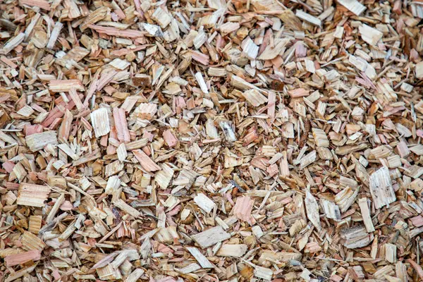 biomass woodchip wooden background of mulching wood chips