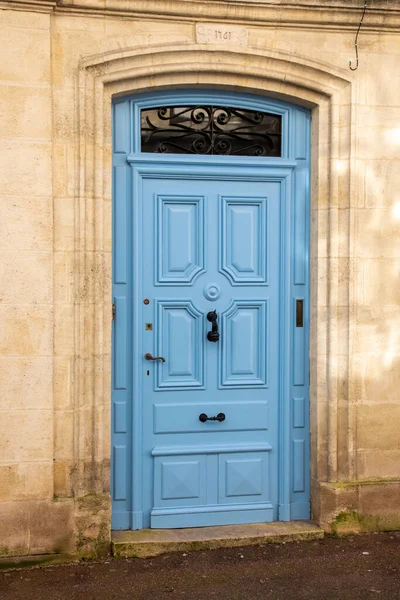 Blue French door wooden traditional european entrance to a private house in the City Center