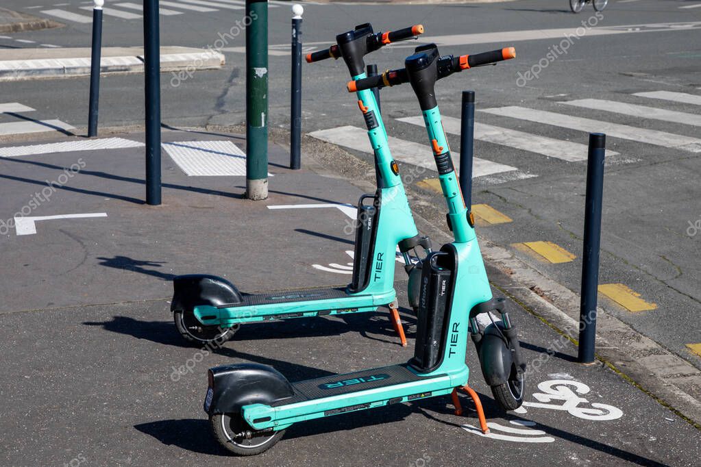 Bordeaux , France -  03 02 2024 : tier swap shared self service electric scooter in town public rental park without station