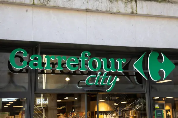 stock image Bordeaux , France -  03 12 2024 : Carrefour city brand logo and text sign front of town store entrance shop supermarket