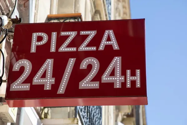 pizza 24/24 restaurant sign pizzeria text on wall facade italian style restaurant