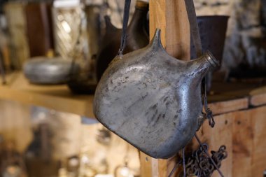 Old vintage metal flask ancient in farm museum Hures la Parade clipart