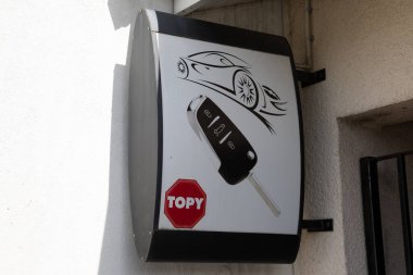 Angouleme , France -  04 08 2024 : topy key car logo brand and text sign on wall facade french shop craftsman duplicate keys lost and repairing shoes heel pose clipart
