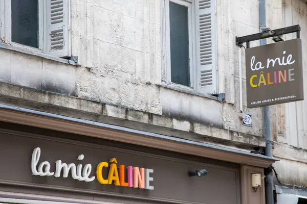 stock image Bordeaux , France -  04 10 2024 : la mie caline logo sign entrance and wall facade shop brand text for industrial french chain bakery store food