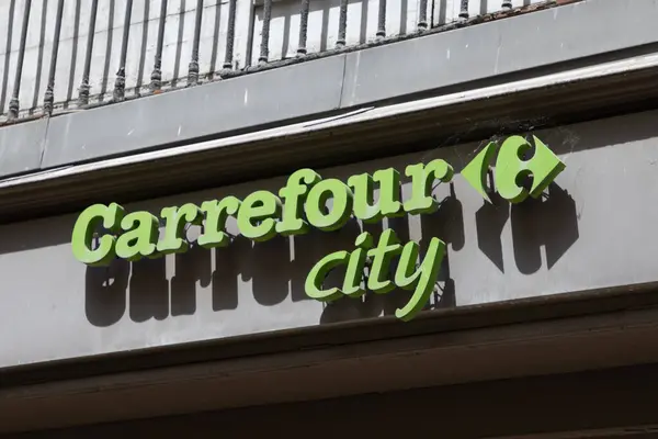 Stock image Bordeaux , France -  06 15 2024 : carrefour city brand logo market and text sign green front of town store entrance shop supermarket