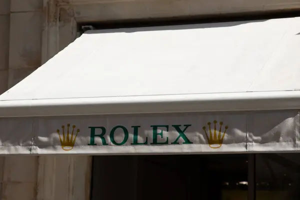 stock image Bordeaux , France - 07 21 2024 : Rolex logo brand and text sign watches wall store Swiss luxury boutique chain watch shop manufacturer from Geneva