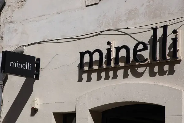 stock image Bordeaux , France - 07 21 2024 : Minelli logo brand fashion shop wall and text sign store on facade entrance boutique chain of shoes footwear