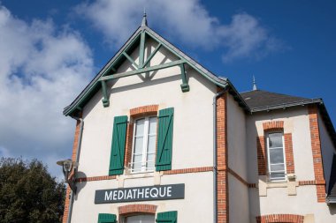 mediatheque sign french text on facade of french village building means municipal media library clipart